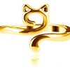 A gold-colored adjustable cat-ear yarn guide ring for knitting and crochet.