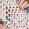 A set of six sheets of vintage angel and saint nail art stickers featuring cherubs and crosses on a hand