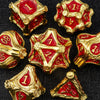 A set of premium zinc alloy metal dice in red and gold, showing various dice shapes and angles.