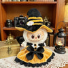 A Halloween pumpkin costume set featuring a black witch hat and orange dress for a 17cm doll.