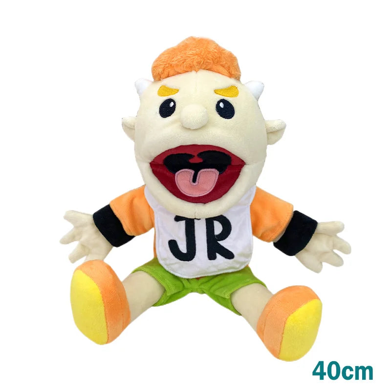 A realistic plush hand puppet resembling a character with orange hair and white teeth wearing a white shirt and green shorts.