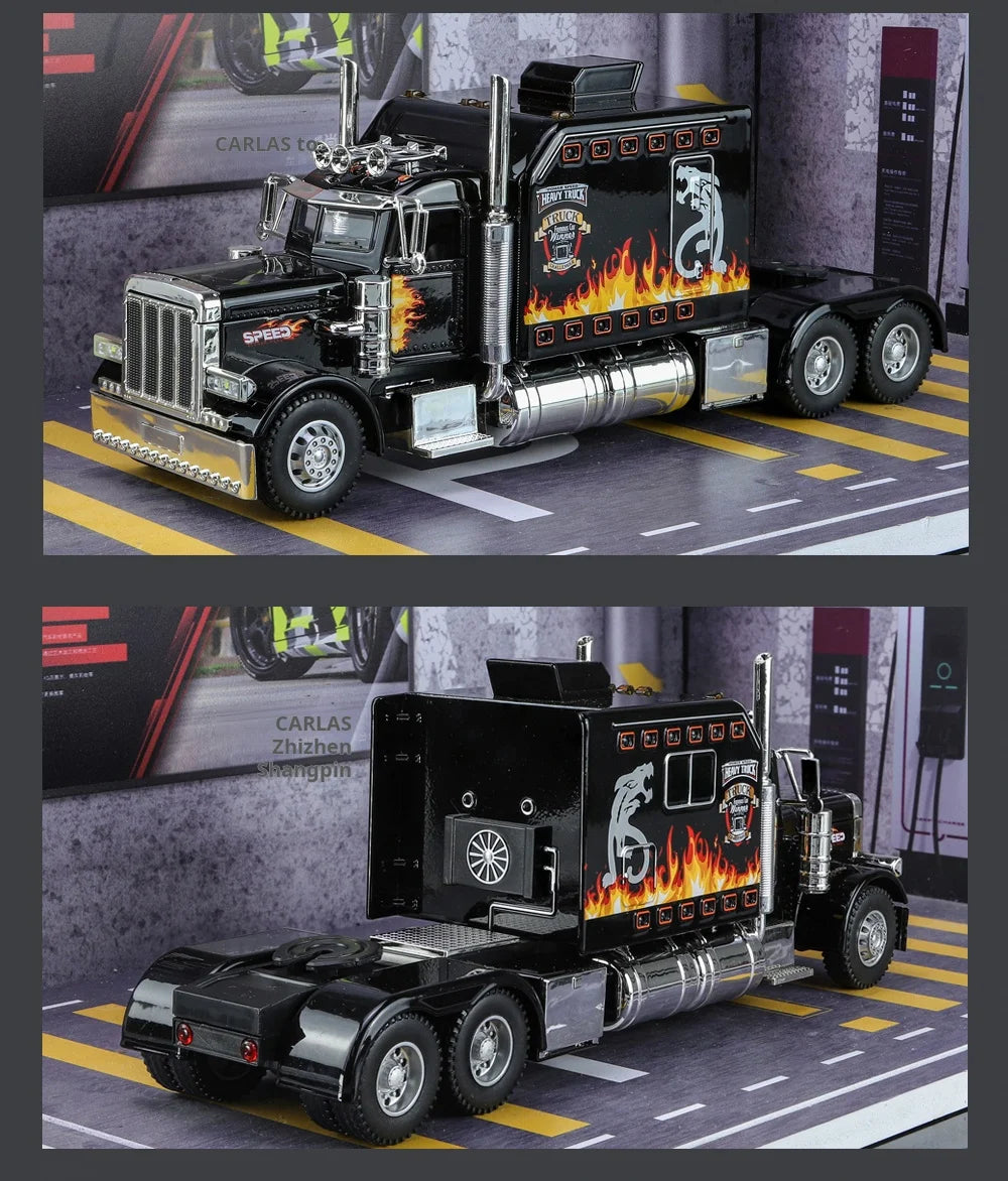 A black Peterbilt 389 diecast truck model with lights and sound displayed on a diorama.