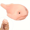 A pink squishy blobfish stress relief toy is shown next to a hand for scale.