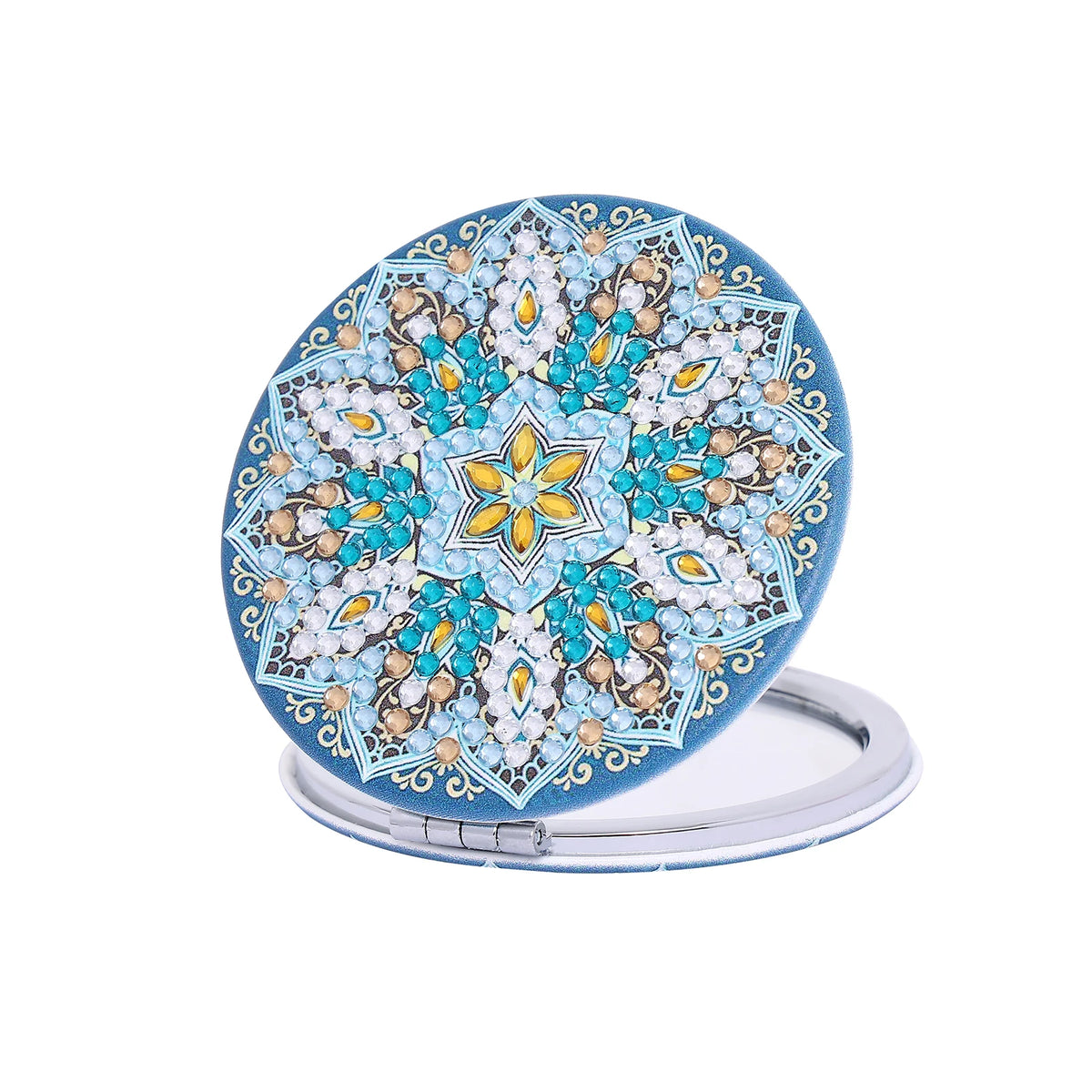 A folding mirror with a blue and gold floral design on the cover.
