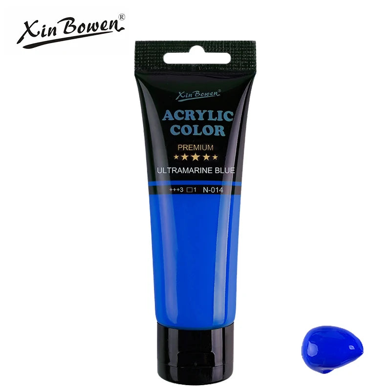A tube of Xin Bowen Premium Ultramarine Blue acrylic color paint with a small swatch of the blue pigment.