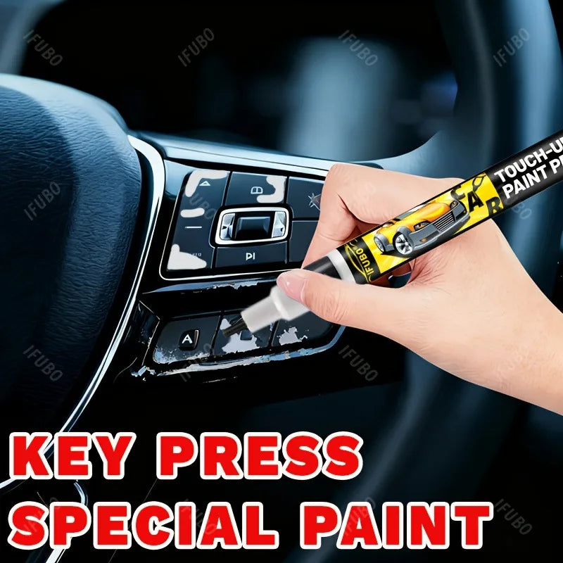A hand applies special paint to touch up scratches on a car interior surface.