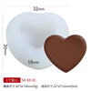 A white silicone heart mold and a brown silicone heart mold are shown next to each other.