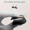A hand holds a black card or item, demonstrating its flexible and durable nature.