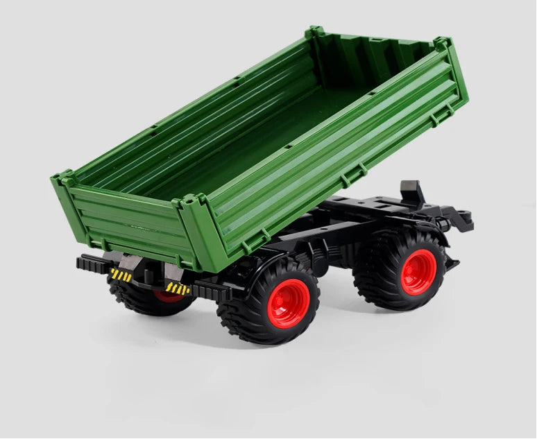 A green remote control tractor with a trailer is shown from above.