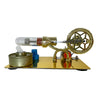 A miniature Stirling engine model featuring a glass bulb and brass components on a gold plate.