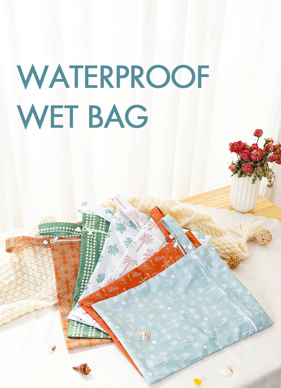 A set of reusable waterproof baby wet bags in various patterns, including orange, green, and light blue, displayed on a white