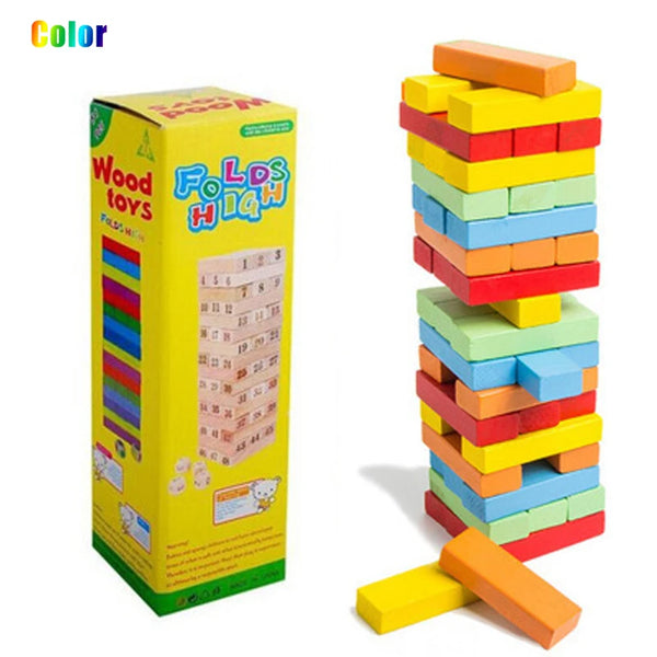 A box of wooden domino balance blocks in various colors stacked and scattered.