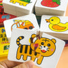 A hand holds a white animal matching card game featuring a yellow tiger and a yellow duck.