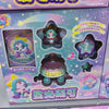 A box of Teenieping Shining Meteor Aurora Doll collectible figures featuring purple and blue characters and star-shaped acces