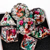 A collection of handmade resin sharp edge dice in various colors and angles displayed on a dark surface.