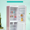 A pink miniature refrigerator playset with interior shelves displaying various food capsules and accessories.