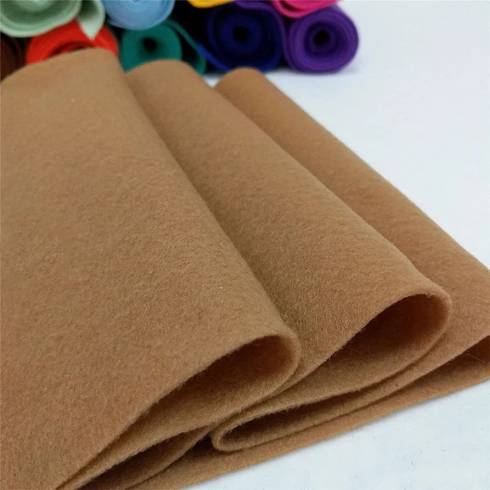 Rolls of tan felt fabric sheet used for DIY crafts and sewing projects