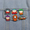 A set of enamel pins featuring characters from South Park, including Cartman and Stan.