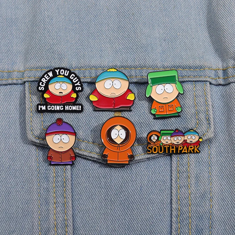 A set of enamel pins featuring characters from South Park, including Cartman and Stan.