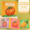A box and puzzle pieces of a fruit edition magnetic puzzle featuring a tomato, pineapple, and other fruits.