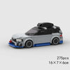A gray and blue classic rally car building block set with a black roof and wheels.