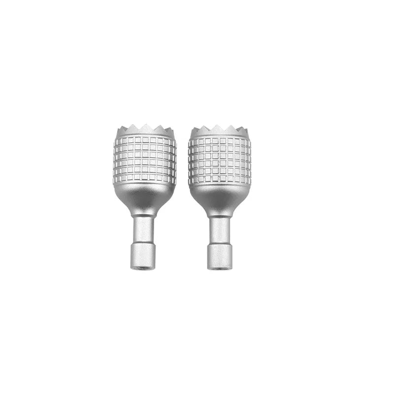 A pair of silver precision CNC aluminum joystick thumb sticks for DJI RC 2 drones.