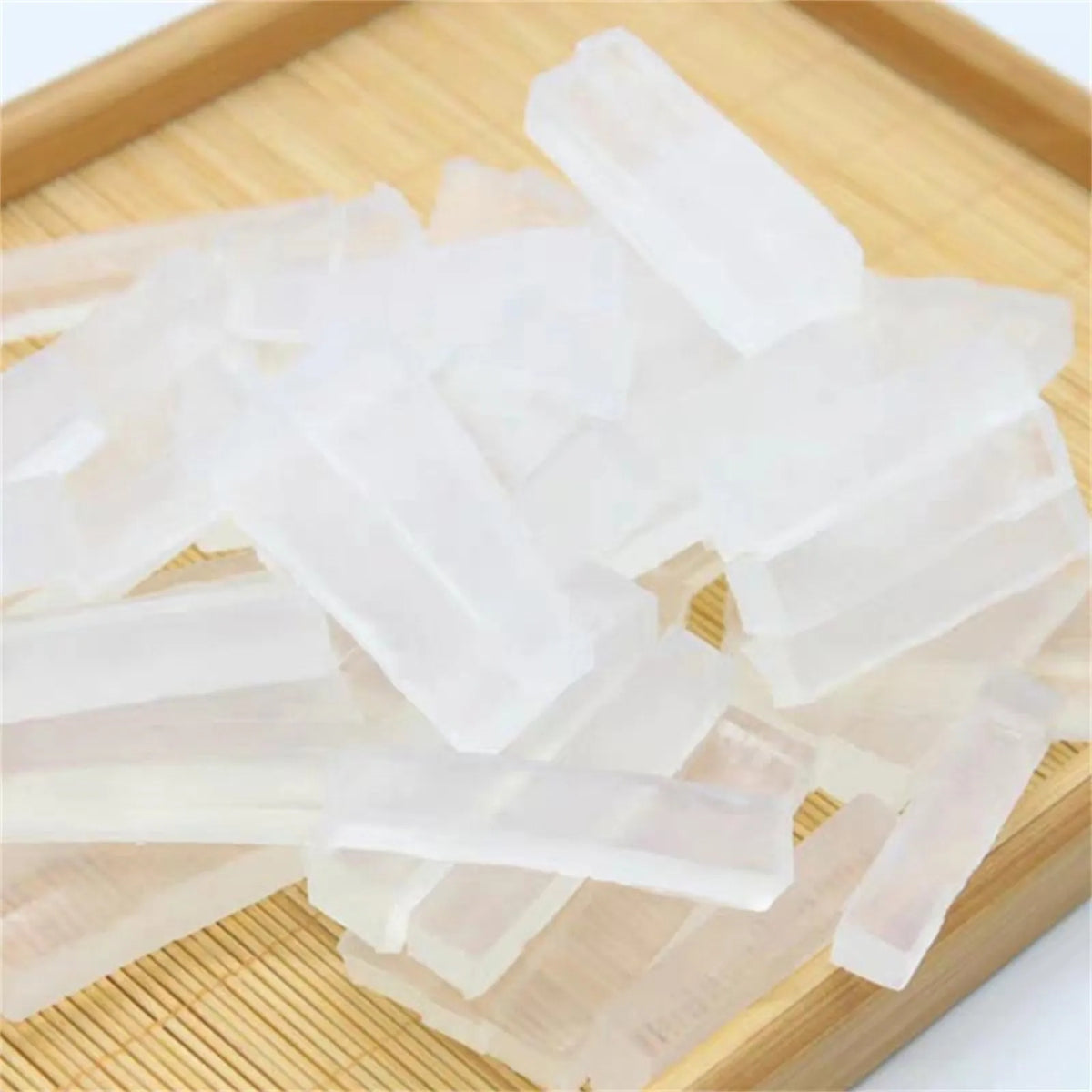 Clear organic transparent soap base for DIY handmade soap making cut into rectangular pieces on a wooden board
