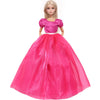 A female doll wearing a vibrant pink satin evening gown with a sweetheart neckline and a full skirt.