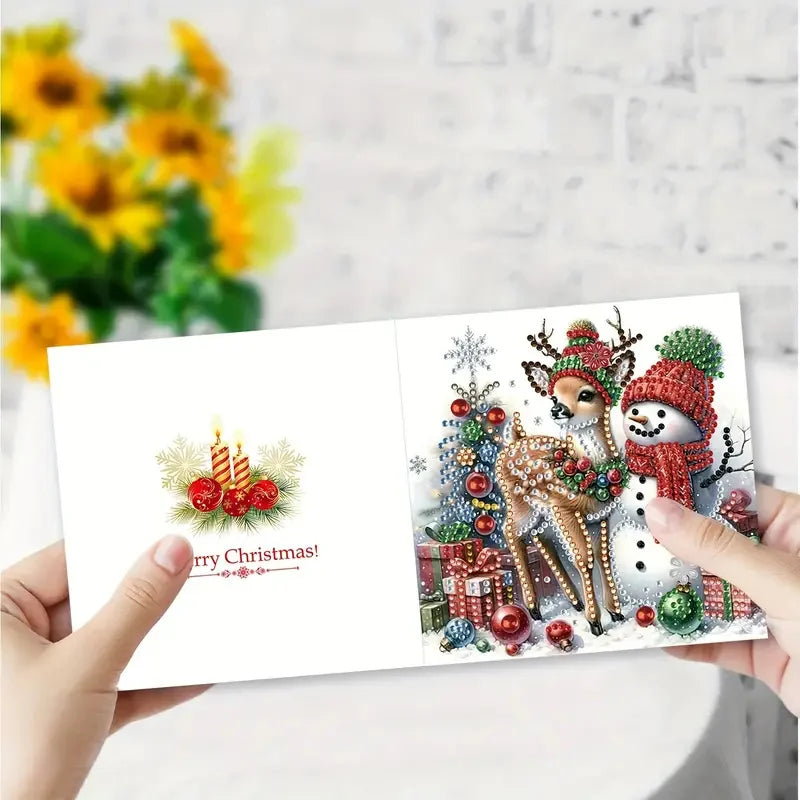 A greeting card featuring a deer decorated with Christmas ornaments and holly, set against a snowy background.