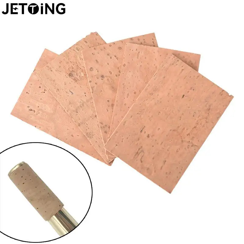 A stack of light brown replacement corks for saxophone necks, shown next to a single cork sample.