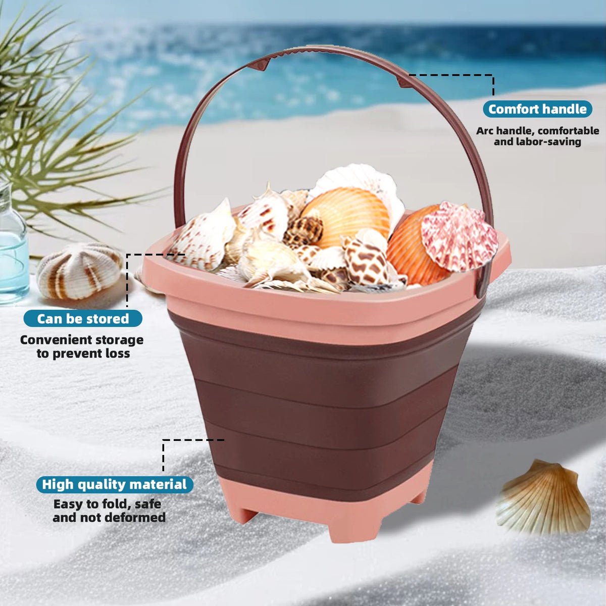 A pink expandable sand bucket toy with a comfort handle filled with seashells on a beach setting.