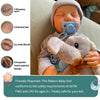 A realistic reborn baby doll with painted features, including sleeping eyes, painted hair, and a lovely mouth.