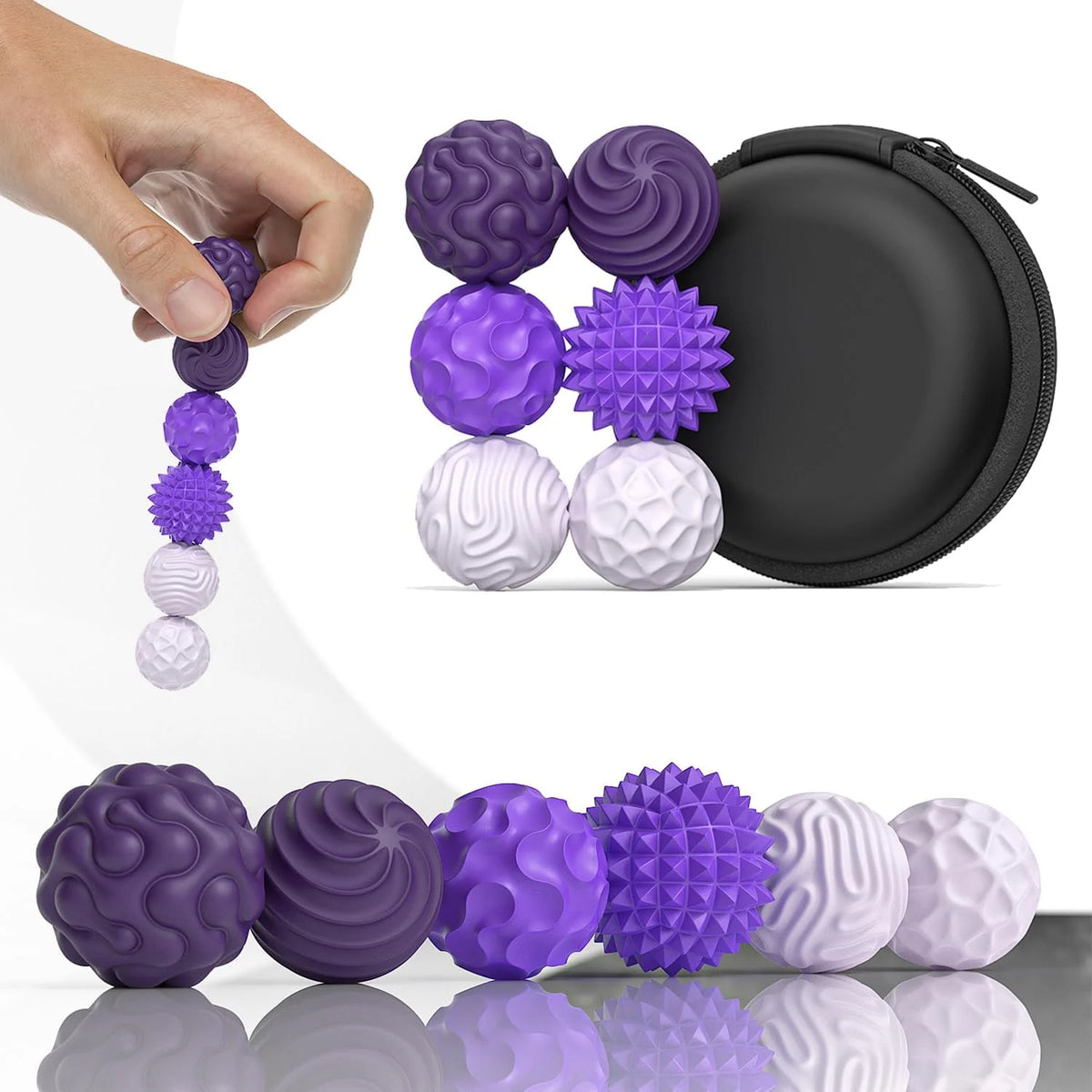 A hand holds a string of purple and white magnetic sensory fidget balls next to a black magnetic container.