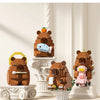 A set of wooden building blocks shaped like cute bears and a capybara fish model kit.