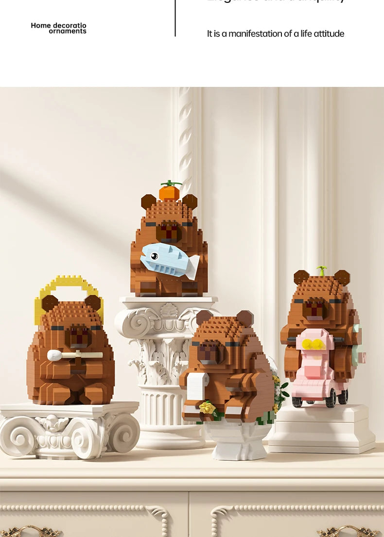 A set of wooden building blocks shaped like cute bears and a capybara fish model kit.