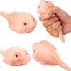 A hand is squeezing a pink squishy blobfish stress relief toy, showing its soft texture and shape.