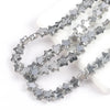 Silver glass star spacer beads arranged in multiple strands for jewelry making