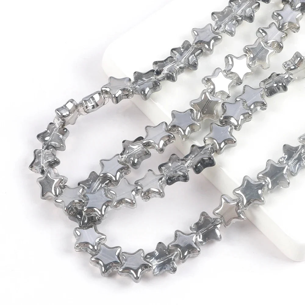 Silver glass star spacer beads arranged in multiple strands for jewelry making