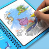 A hand is drawing colorful, whimsical creatures in a reusable water drawing book with a magic pen.