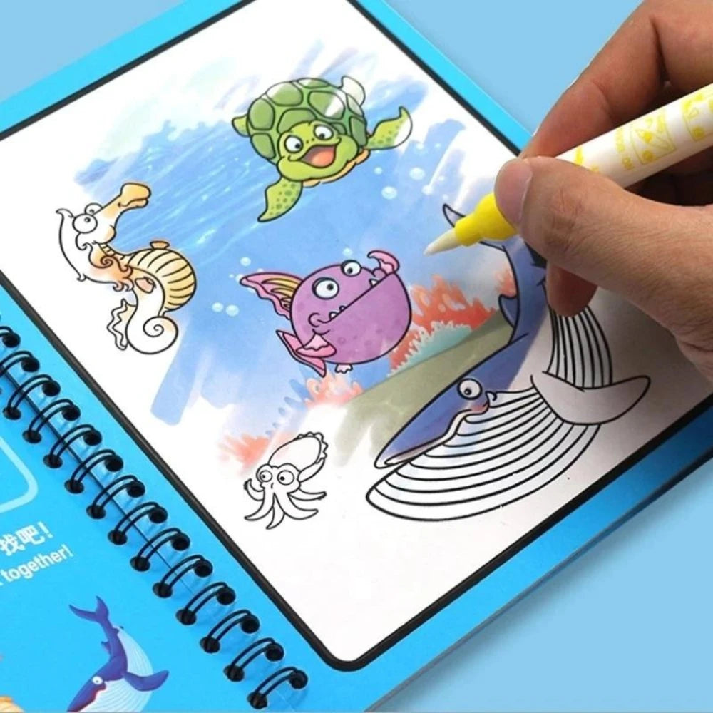 A hand is drawing colorful, whimsical creatures in a reusable water drawing book with a magic pen.