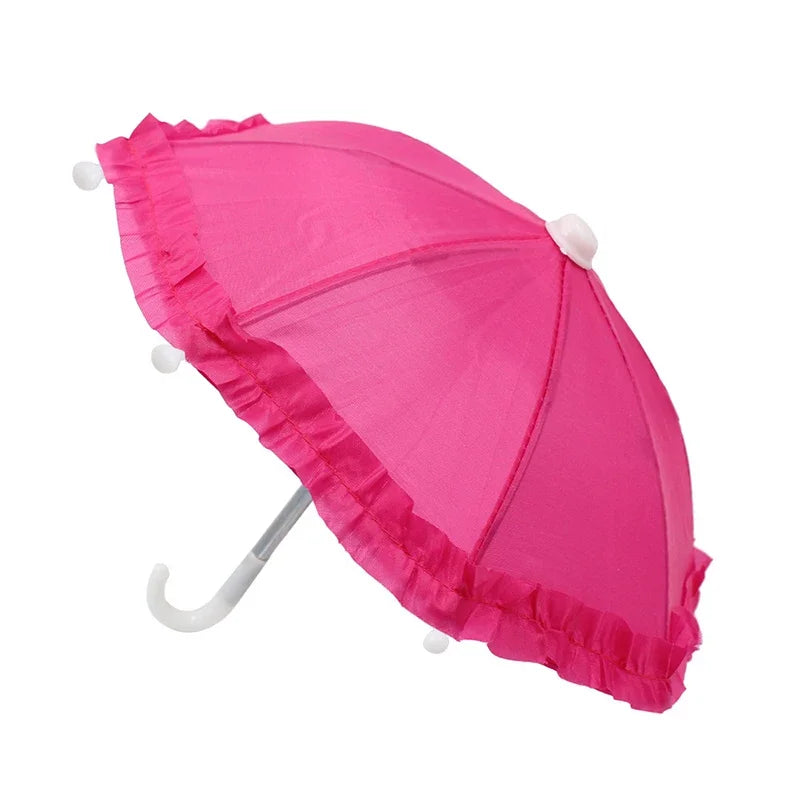 A bright pink umbrella with a lace trim and bear design, shown open.