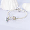 A sterling silver rotatable Rubik's cube charm for bracelets displayed on a white background.