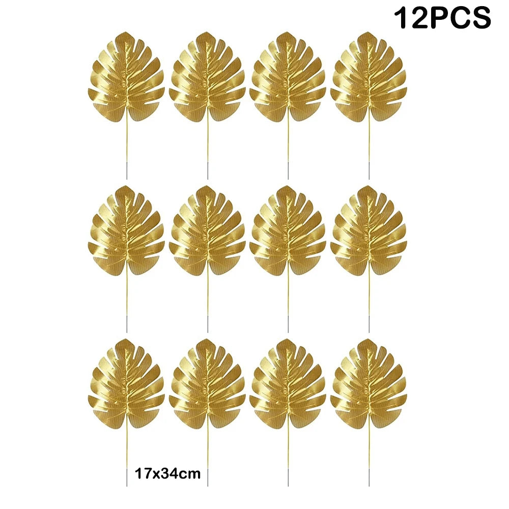 Twelve artificial gold tropical palm leaves on sticks for party decoration