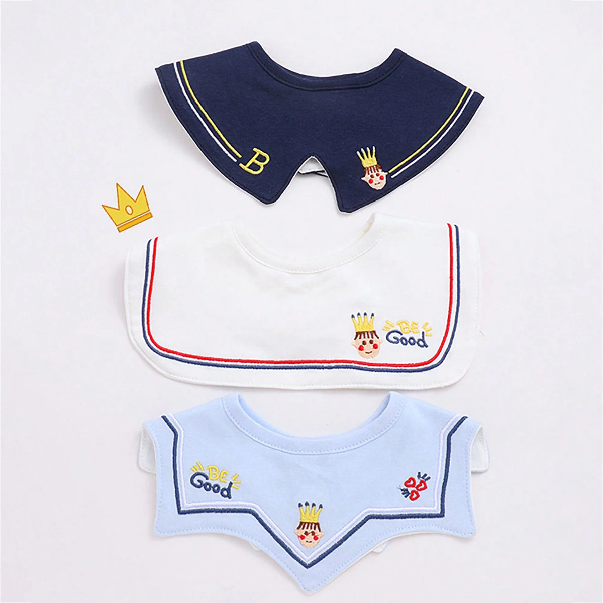 A set of three baby waterproof drool bibs featuring a navy blue design with gold accents and a light blue version.