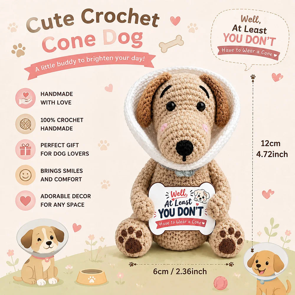 A handmade crochet cone dog doll with a motivational card sitting on a light background.