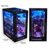 A black DIY book nook kit featuring a futuristic cyberpunk city scene with miniature furniture and lighting.