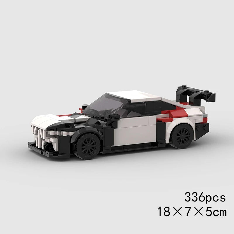 A black and white classic rally car building block set with red accents, shown from the side.