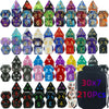 A collection of polyhedral dice in various colors and shapes packaged in a dark pouch.