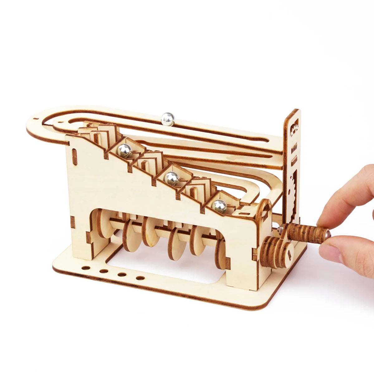 A wooden spiral marble run DIY puzzle kit showing a track and a threaded mechanism.