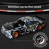 A black and white patterned mini RC drift car is shown with a full-scale directional control wheel.